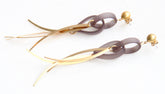 Grey leather women's in-the-vines-earrings with distinctive the-link metal wind